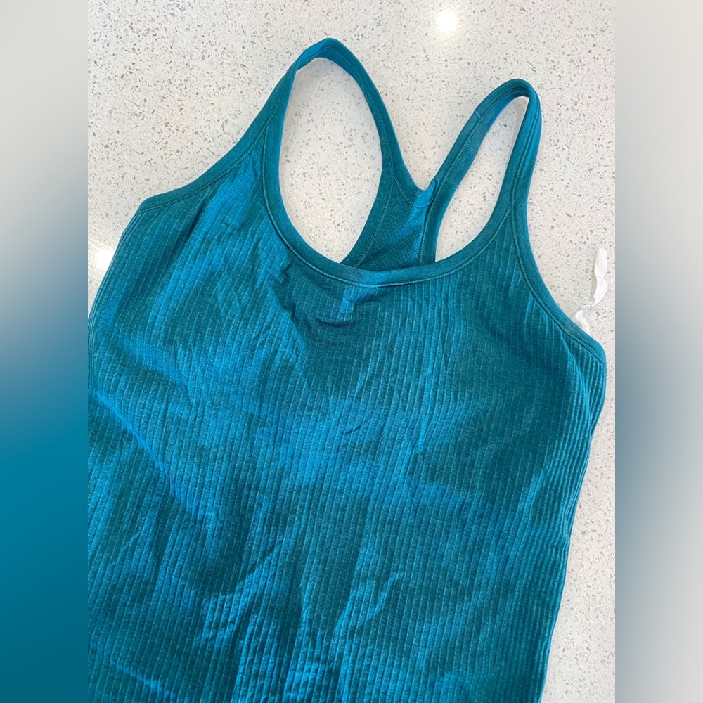 Lululemon size 8 teal tank. Barely worn. Great condition.